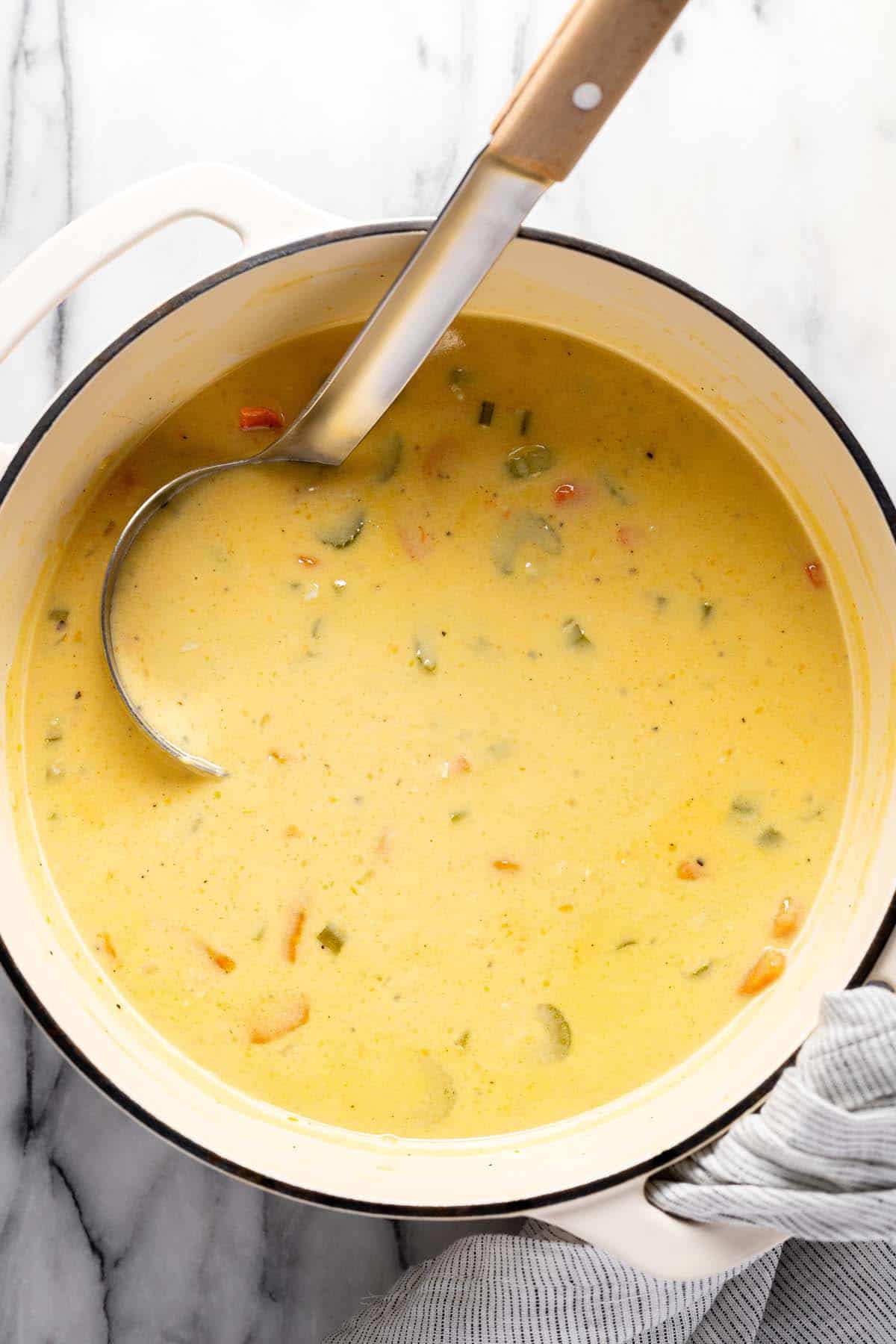 Cheesy potato soup in a large pot. 