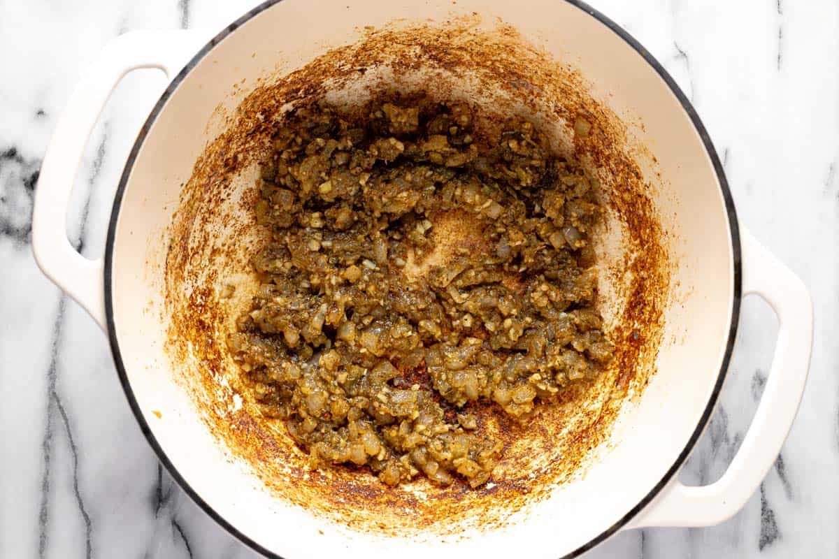 Sauteed onion, garlic, dried herbs, and flour in a large pot. 