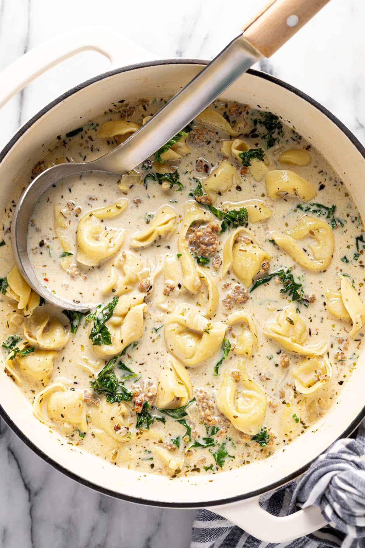 Large pot of sausage, tortellini, kale soup. 