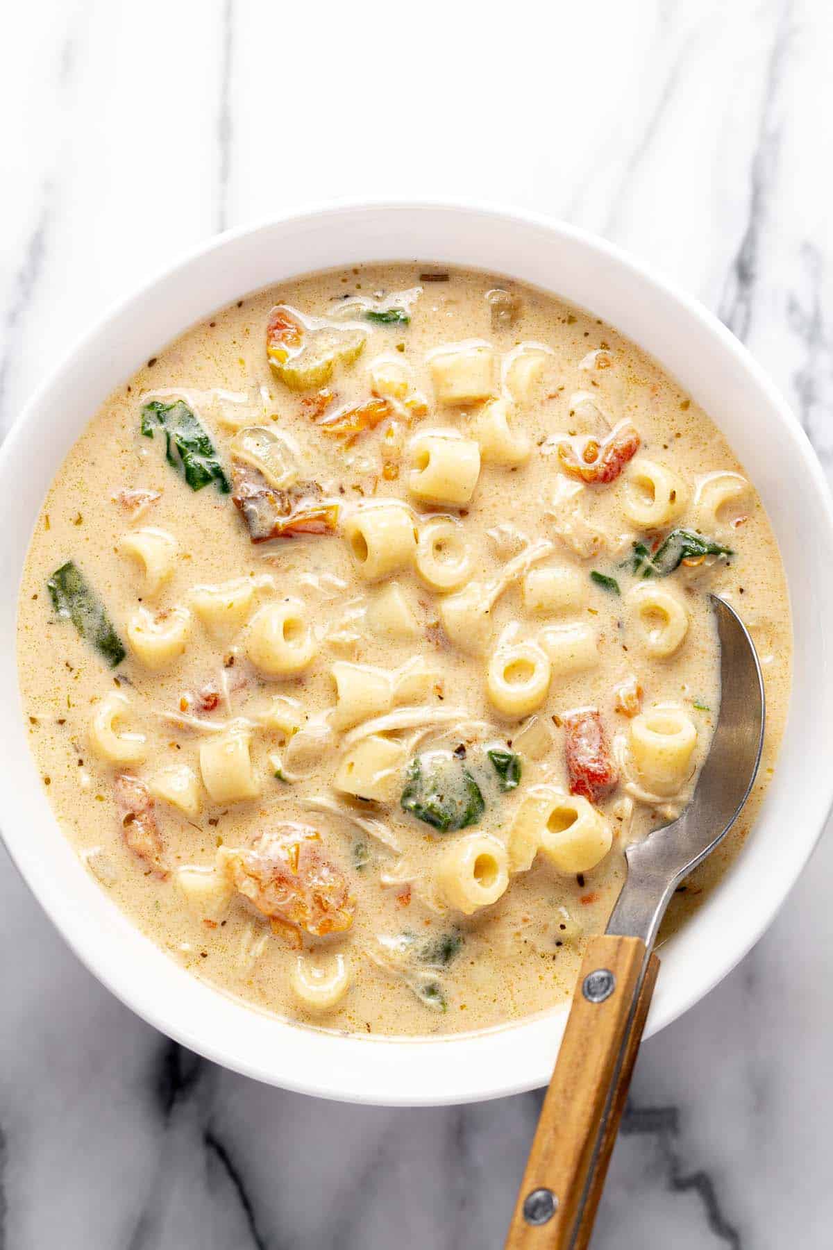 Bowl of creamy Tuscan chicken noodle soup. 