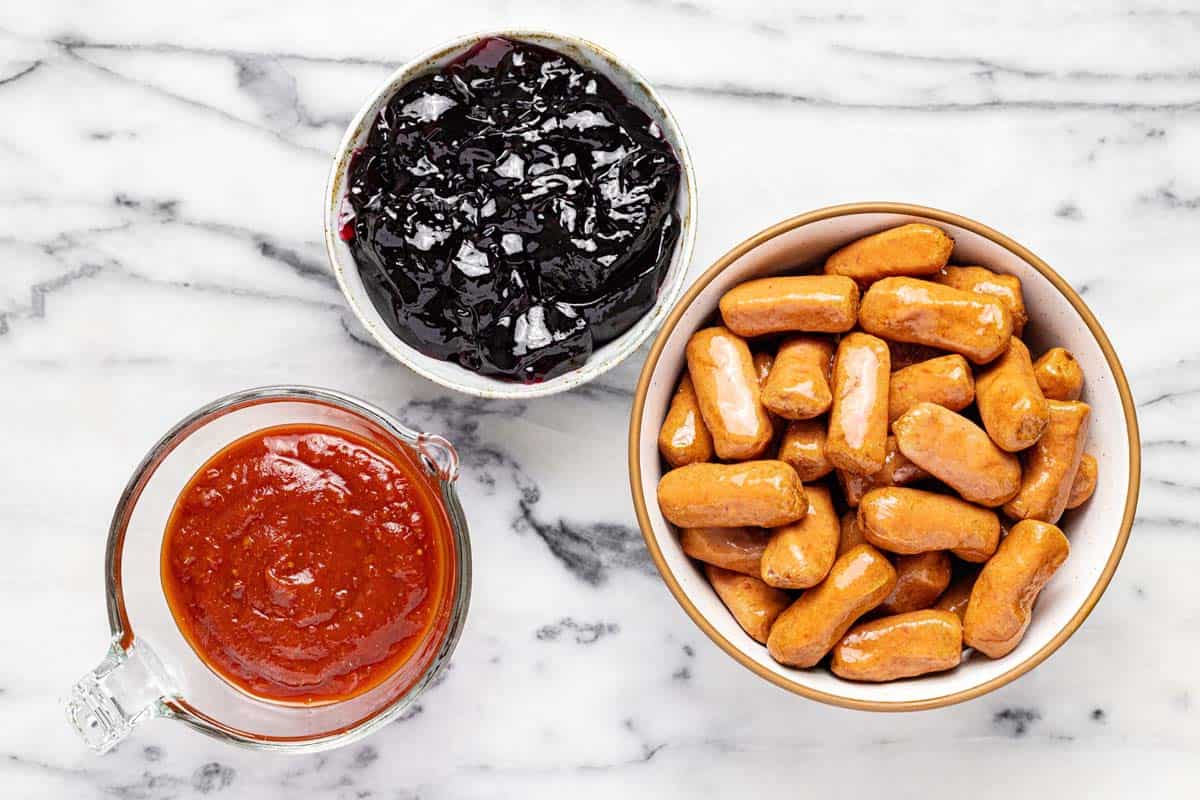 Bowls of ingredients to make lit'l smokies with chili sauce and grape jelly. 