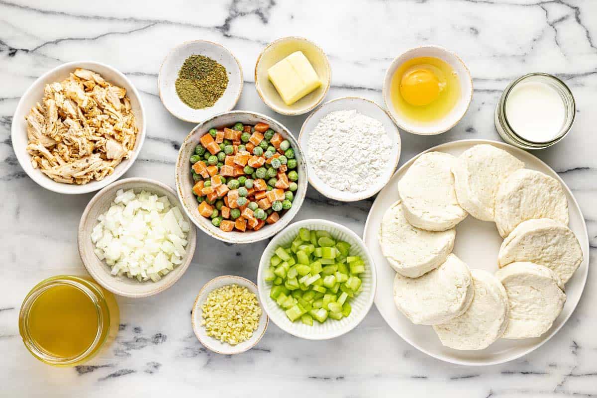 Bowls of ingredients to make mini chicken pot pies. 