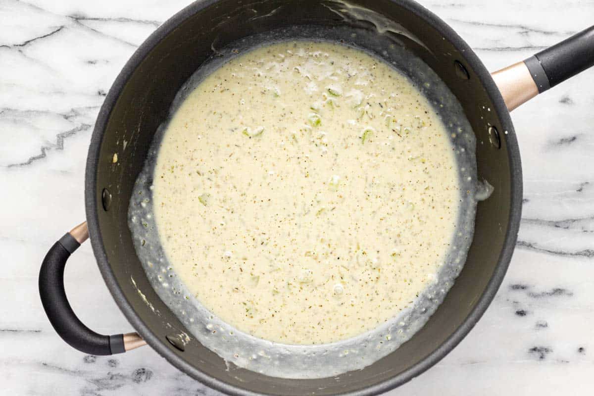 Creamy pot pie sauce in a large pan. 