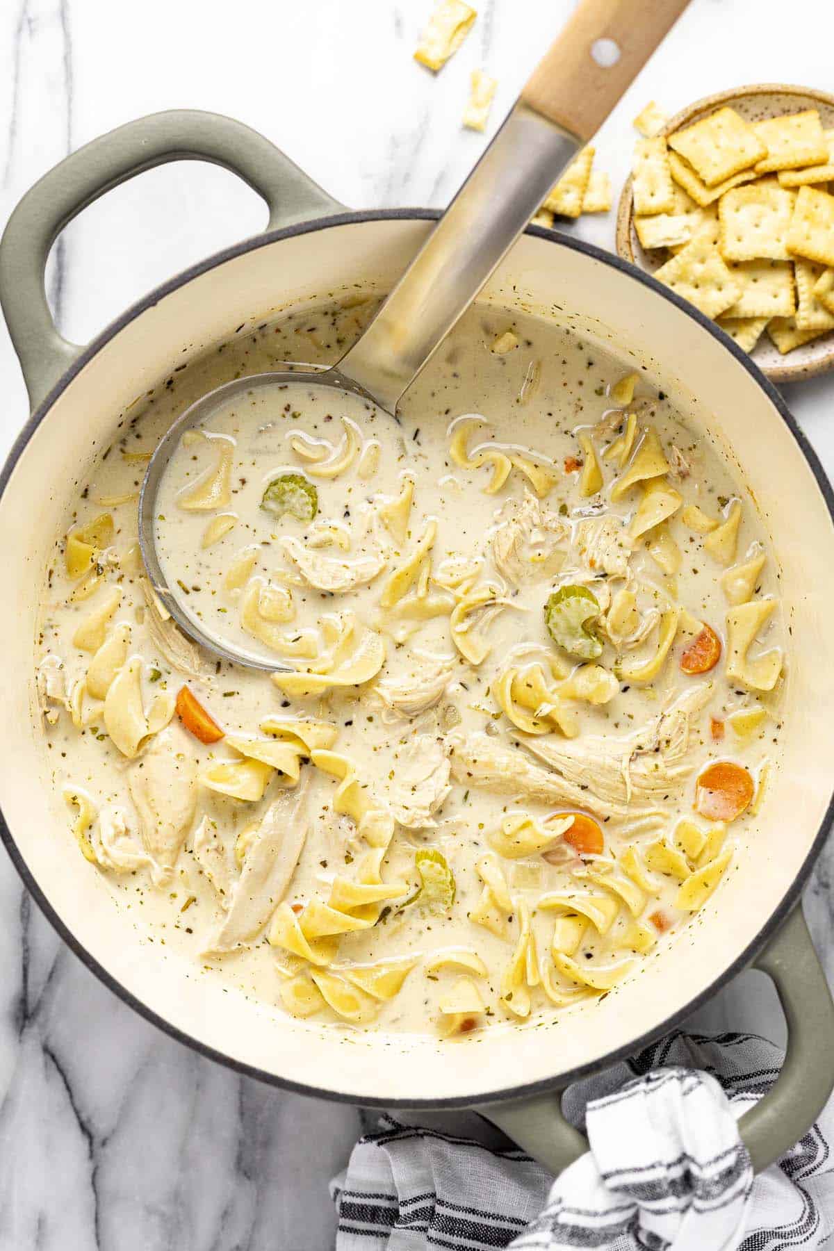 Large pot of rotisserie chicken noodle soup. 