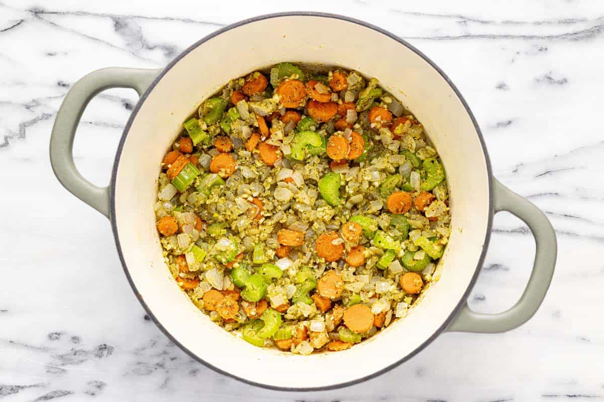 Pot filled with sauteed veggies in butter and flour. 