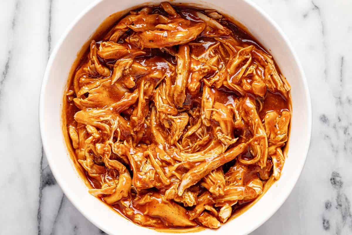 Shredded BBQ chicken in a large bowl. 