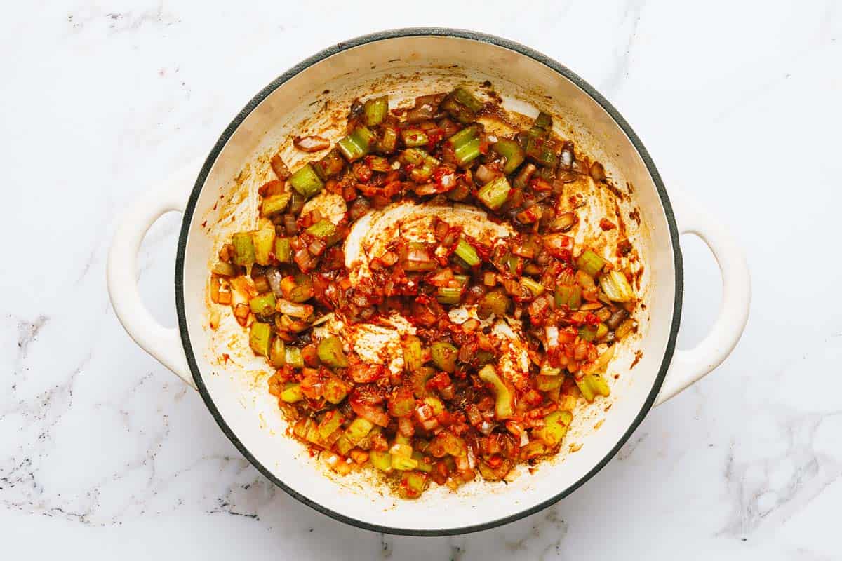 Veggies, herbs, and garlic cooked with tomato paste. 