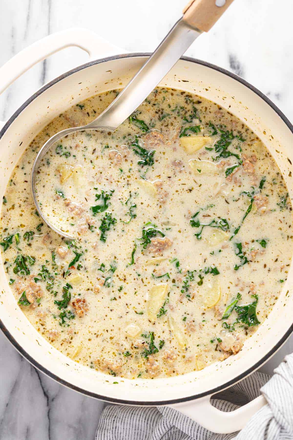 Large pot of creamy sausage and potato soup.