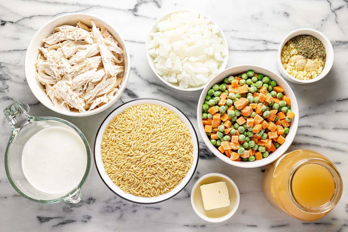 Bowls of ingredients to make creamy chicken and orzo. 