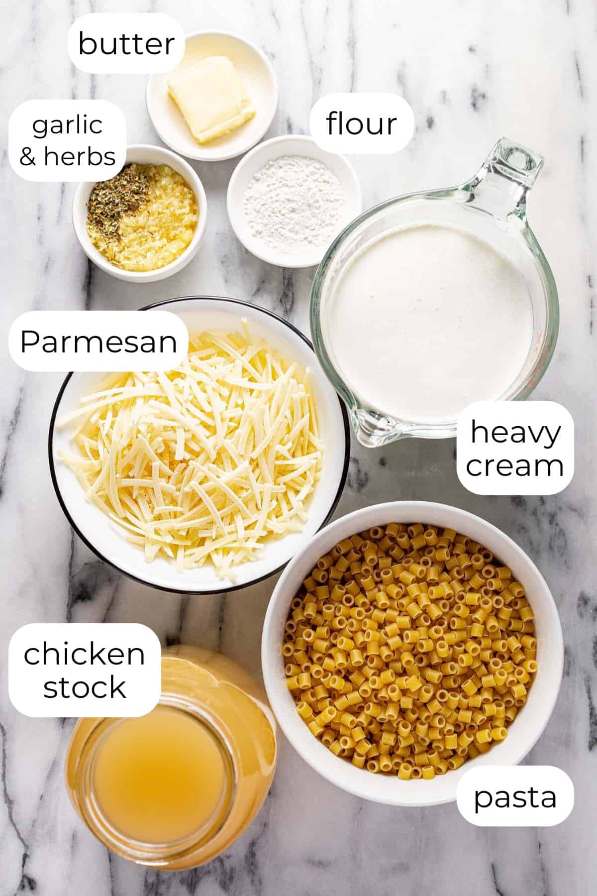 Bowls of ingredients to make garlic Parmesan soup. 