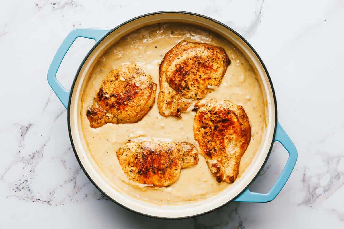 Seared pork chops in creamy mushroom pan sauce. 