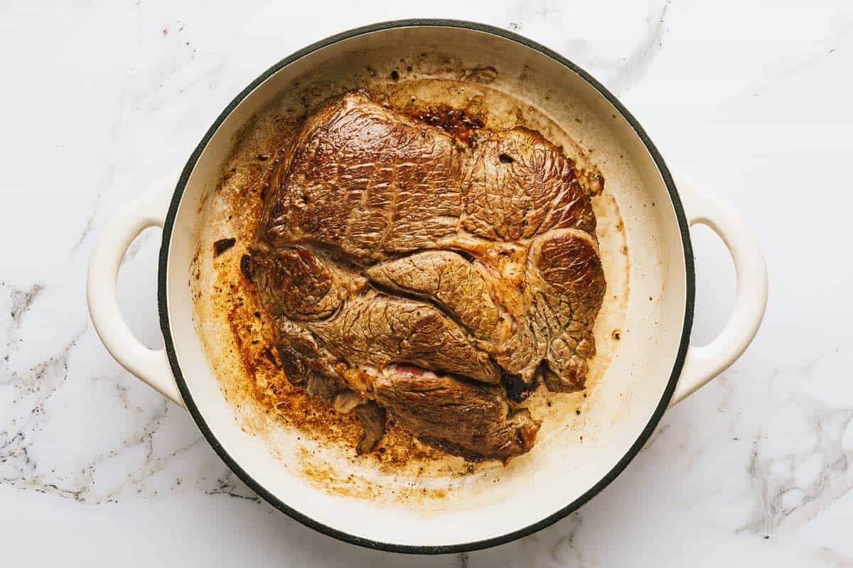 Seared roast in a large pot. 