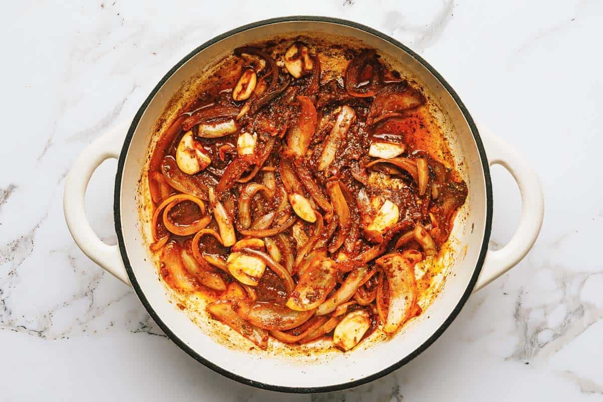 Sauteed onions and garlic with tomato paste and herbs. 