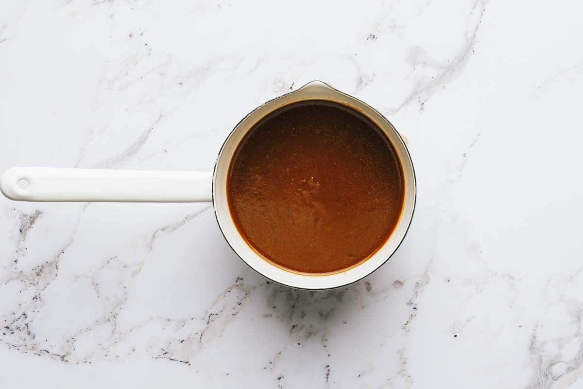 Homemade gravy in a saucepan. 