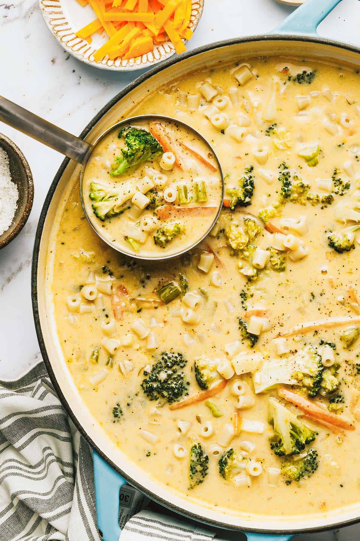 Large pot of cheesy broccoli noodle soup. 