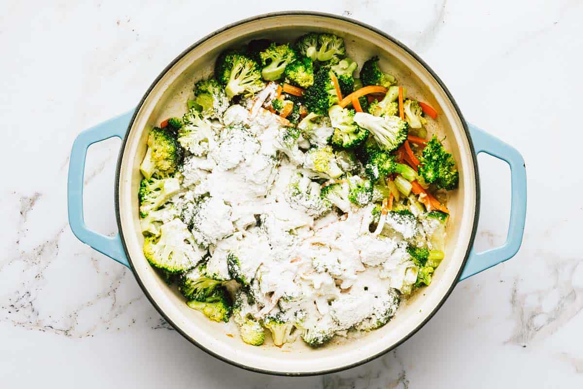 Flour sprinkled over veggies to make soup. 