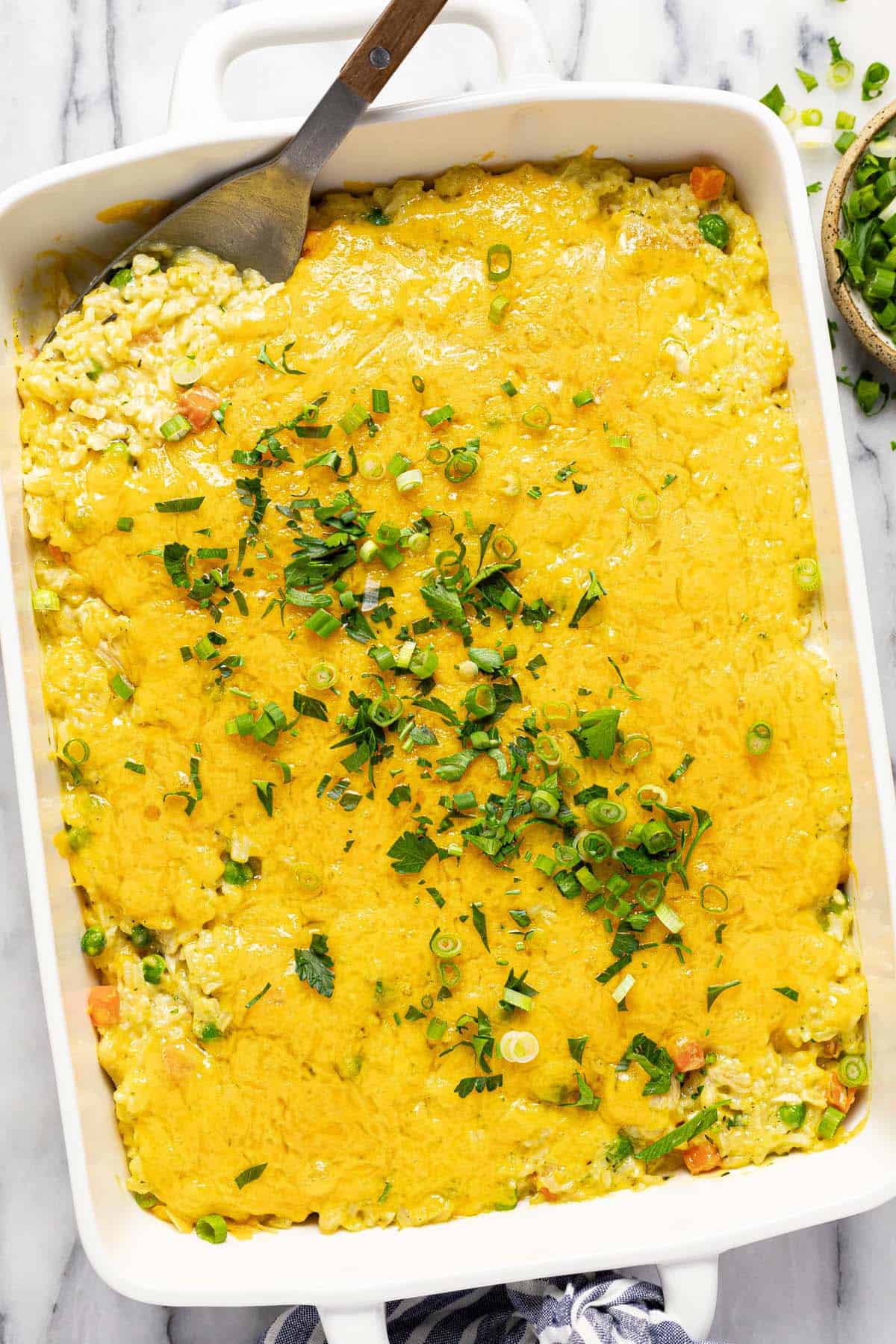 Large baking dish filled with chicken and rice casserole. 