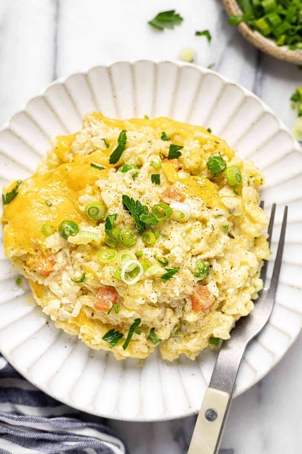 Small plate with creamy chicken and rice casserole. 