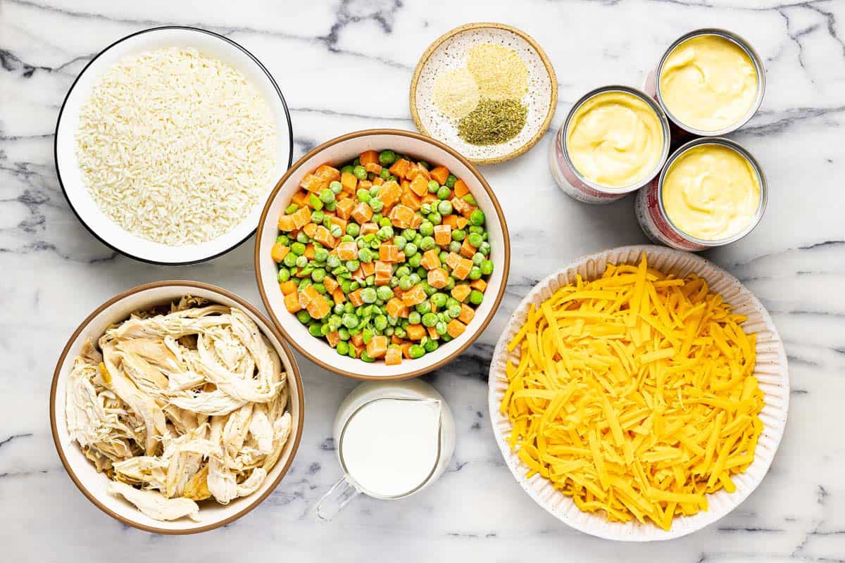 Bowls of ingredients to make chicken and rice casserole. 