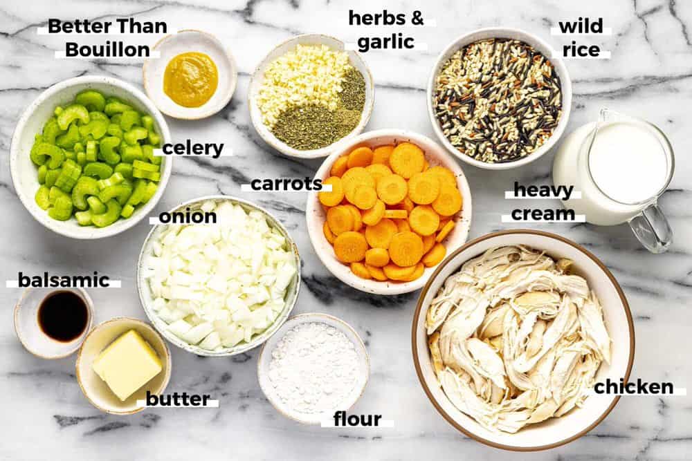 Bowls of ingredients to make chicken wild rice soup. 