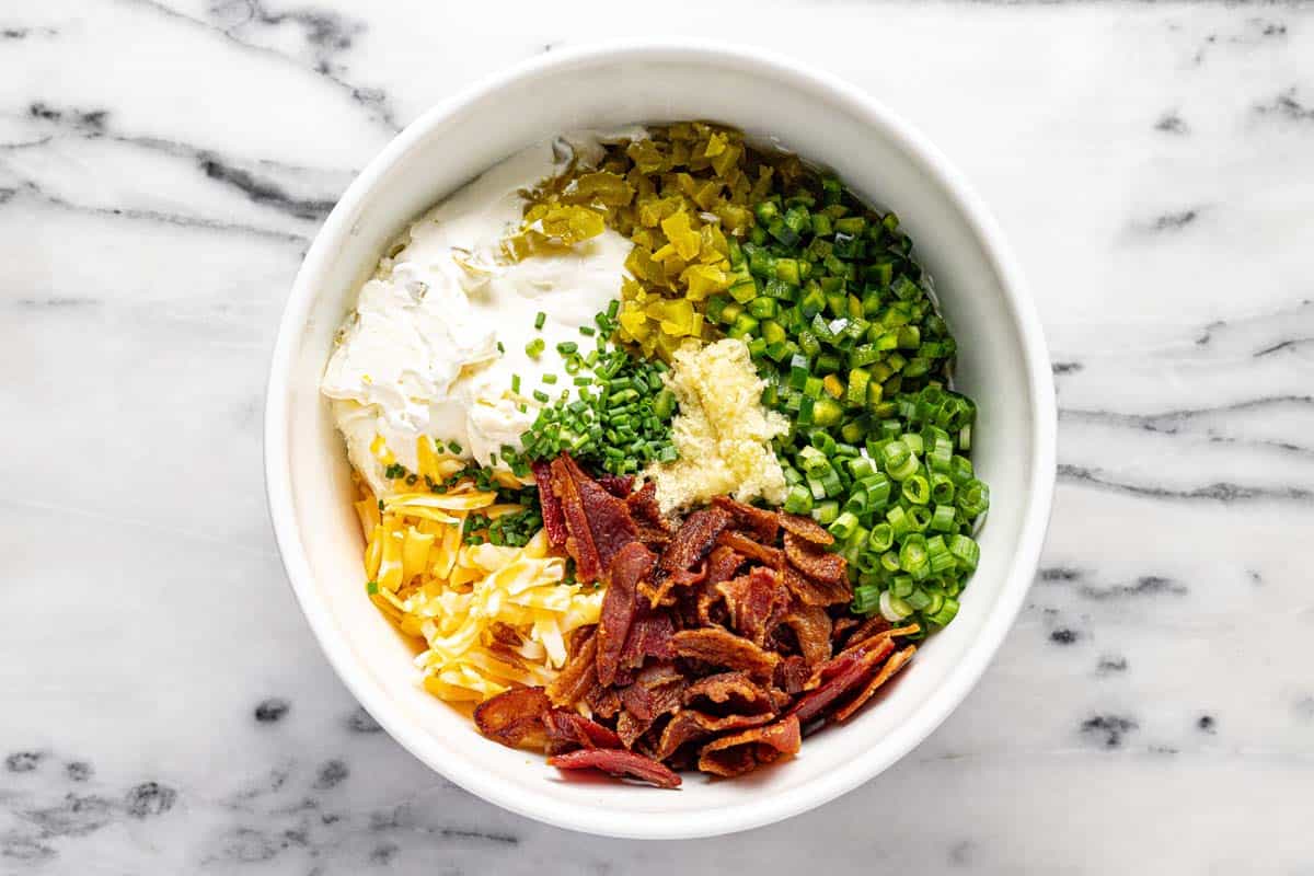 Bowl of ingredients to make cheesy jalapeno popper bread. 