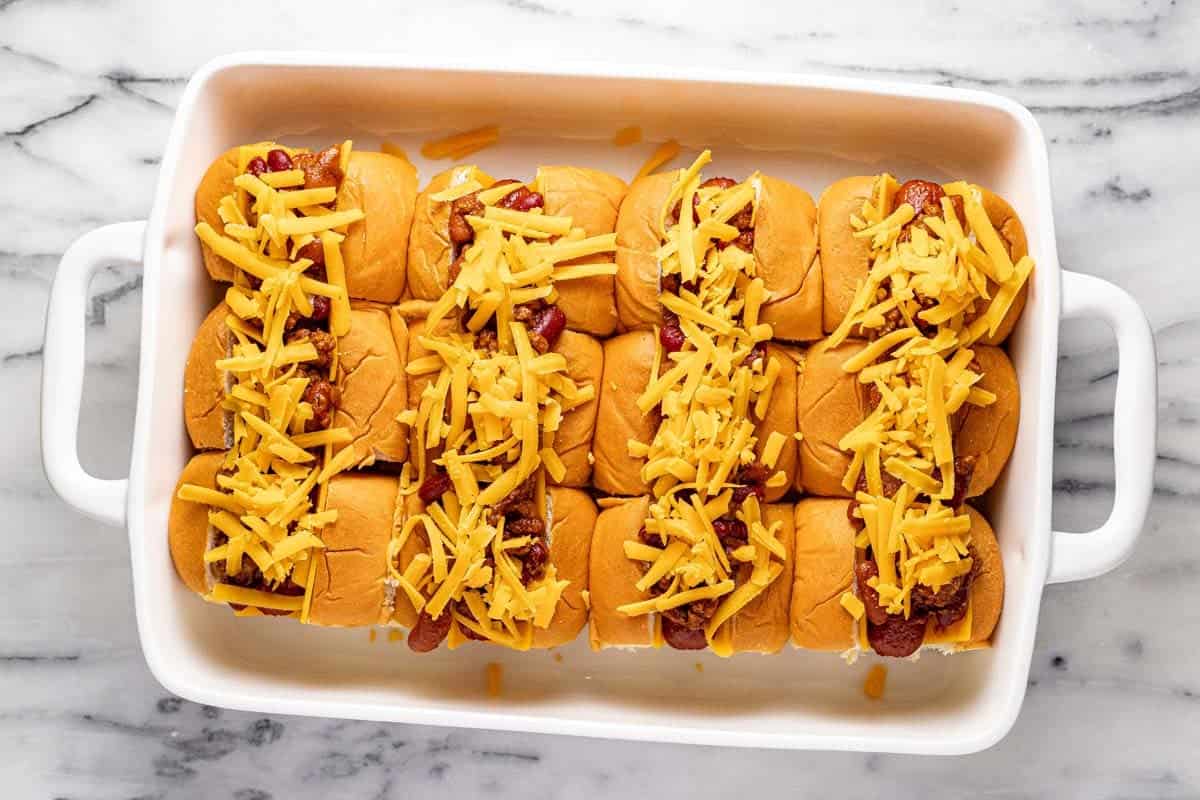 Mini chili cheese dogs ready to be baked in the oven. 