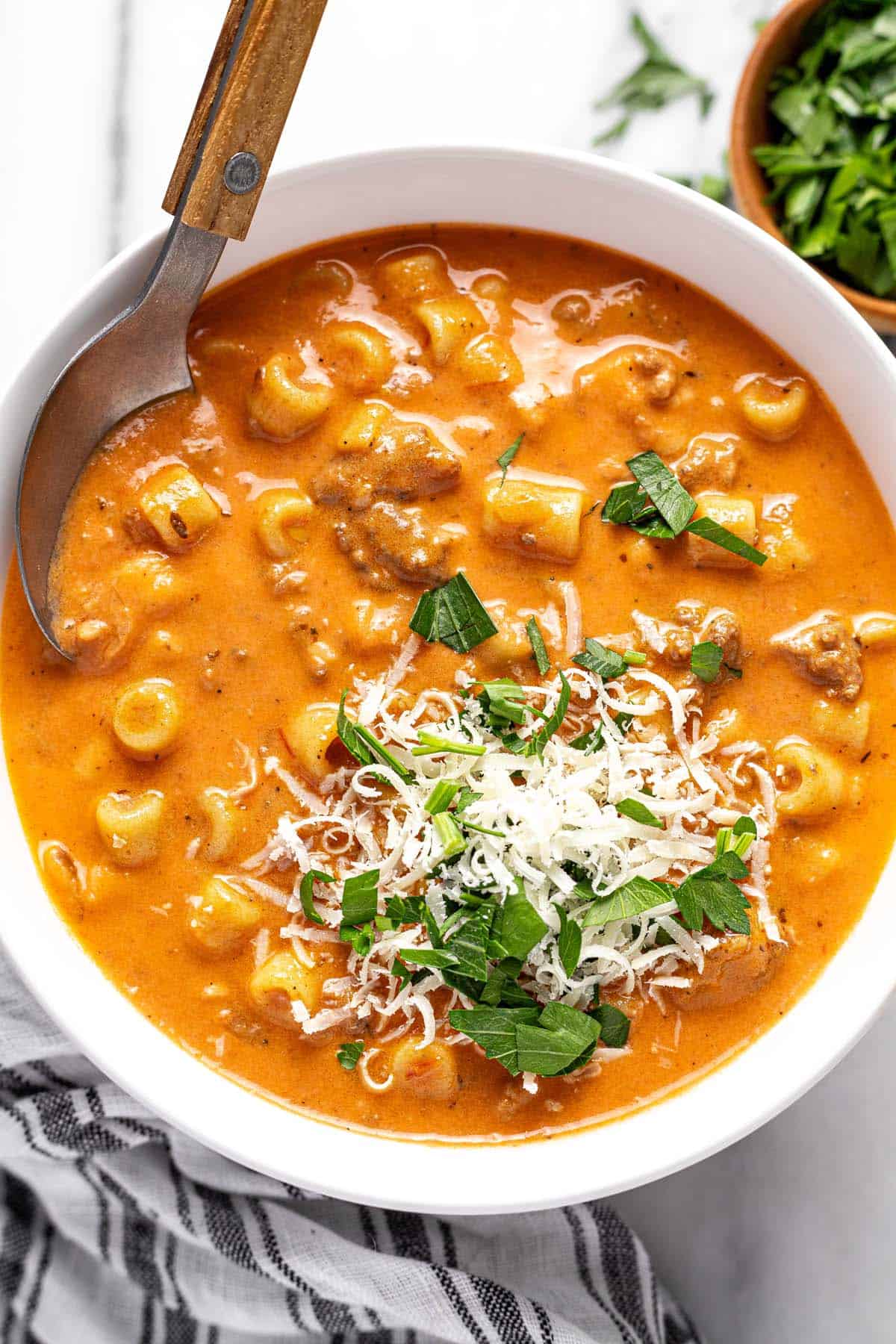 Fresh Parmesan and parsley on top of creamy beef and tomato soup. 