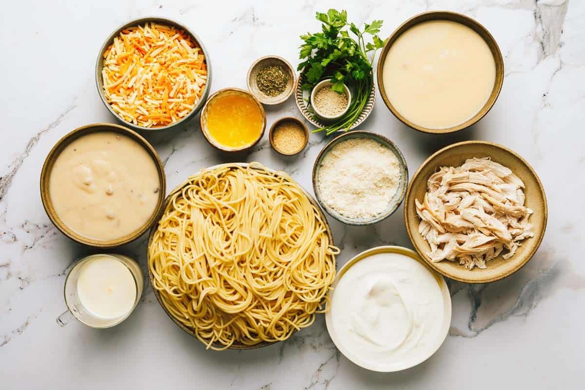 Bowls of ingredients to make chicken tetrazzini. 