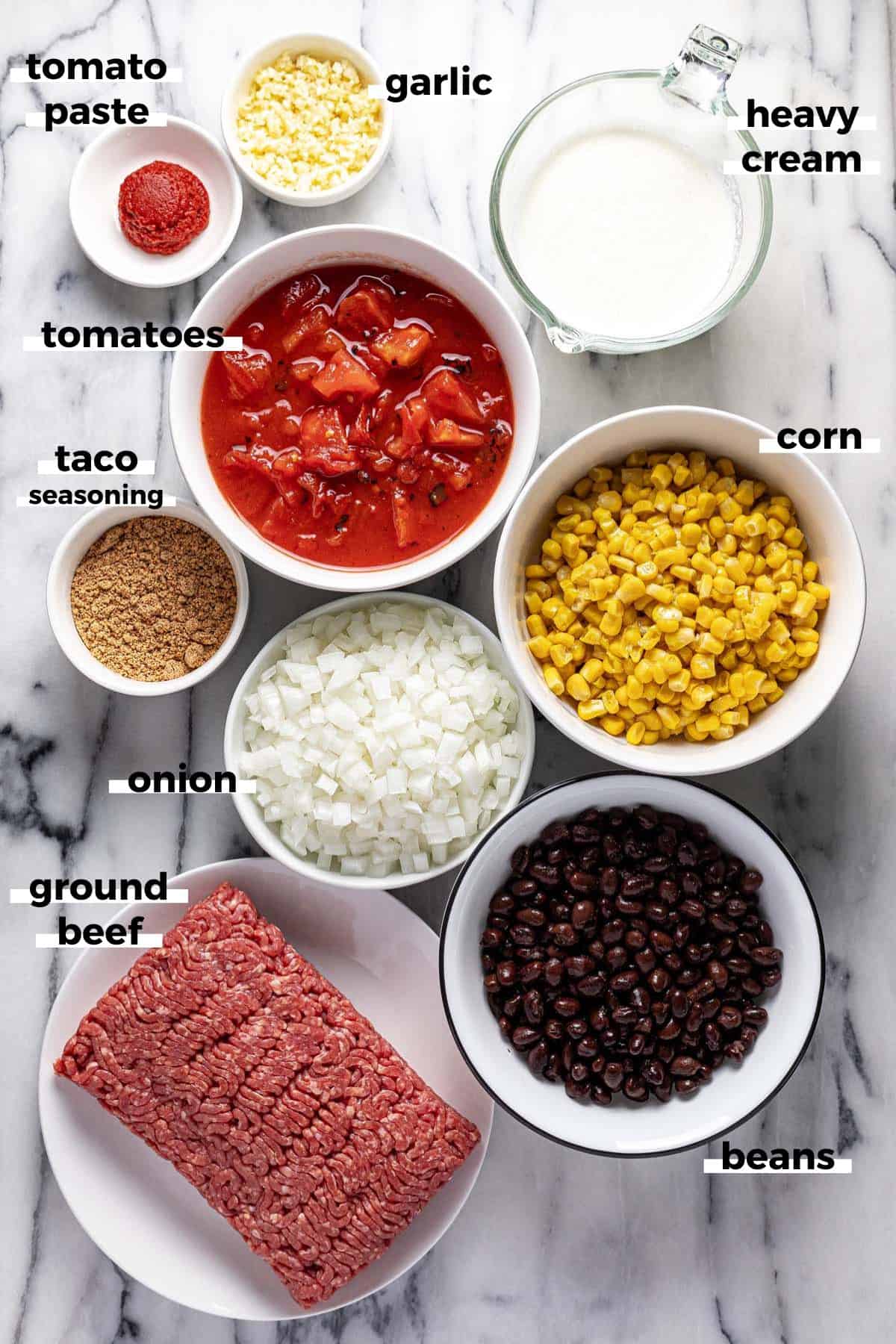 Bowls of ingredients to make creamy taco soup.