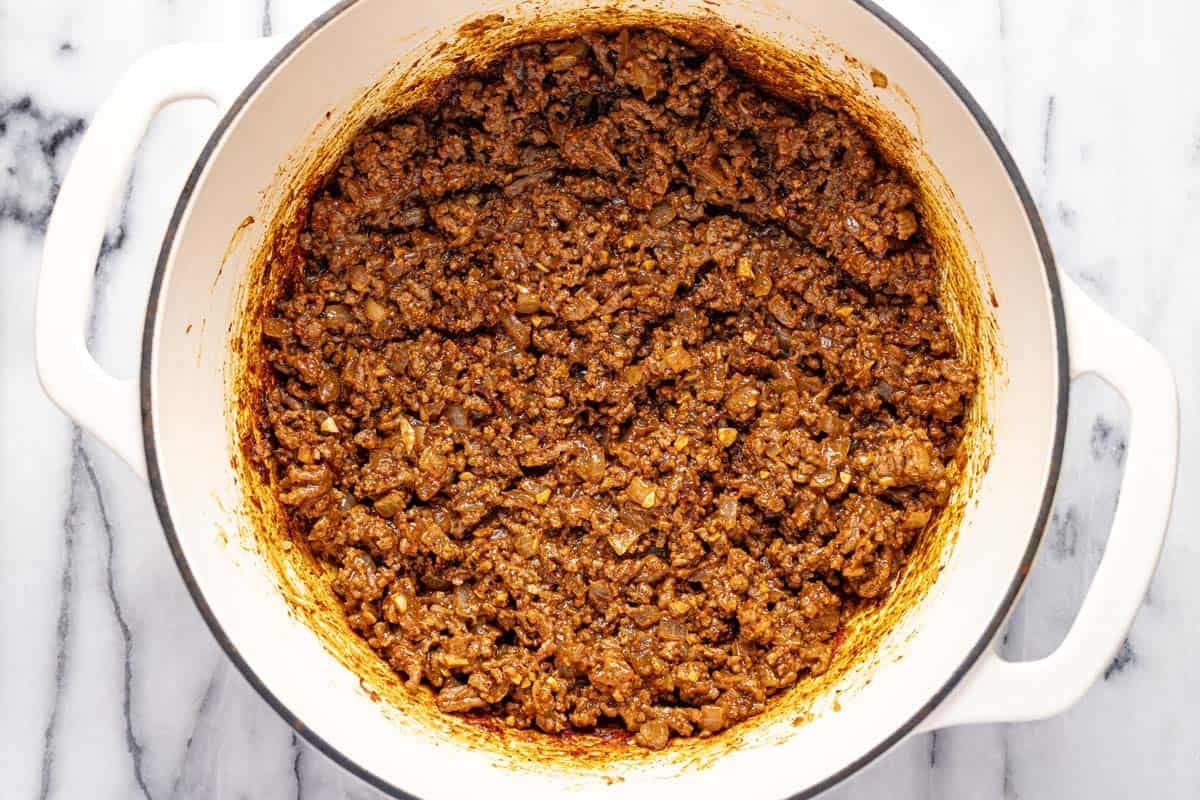 Browned ground beef taco meat in a large pot. 