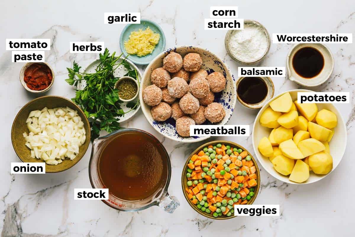 Bowls of ingredients to make meatball stew. 