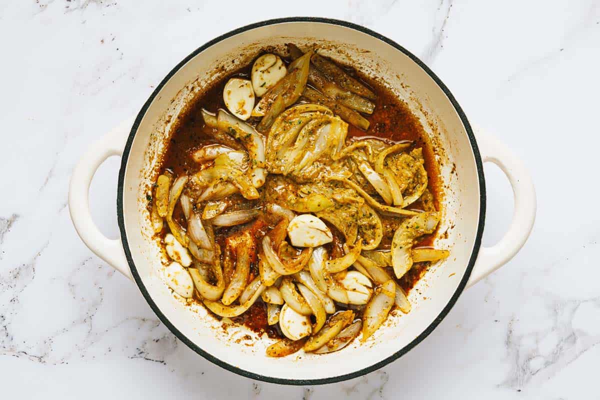 Sauteed veggies and garlic in a large pan. 