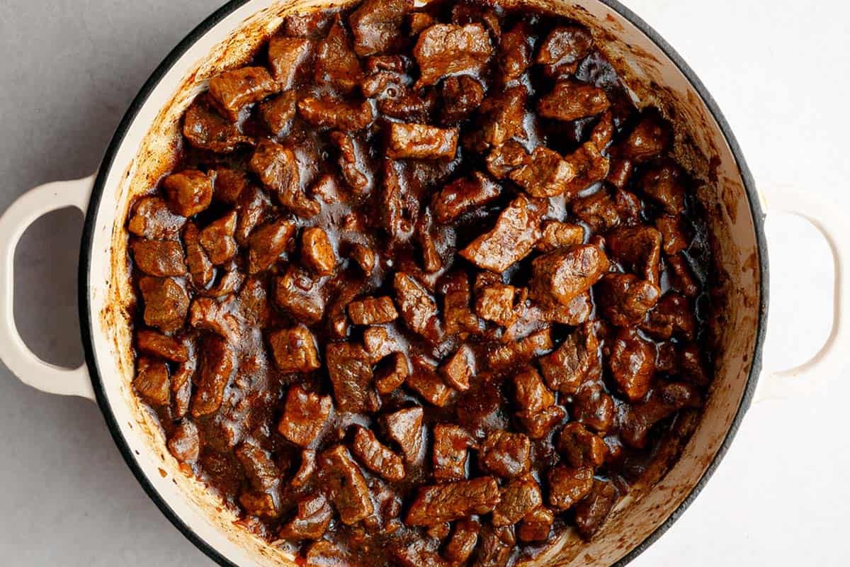 Large pan with tender beef and creamy gravy. 