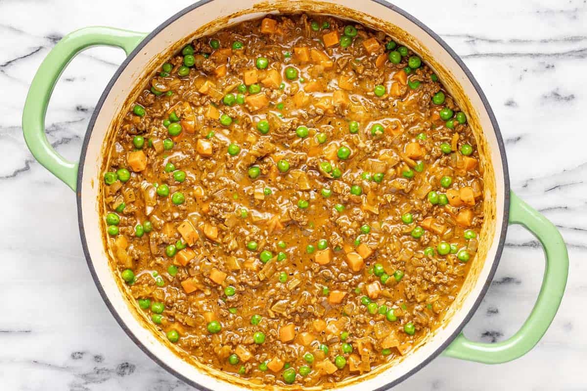 Large pan filled with beef and veggies in brown gravy. 