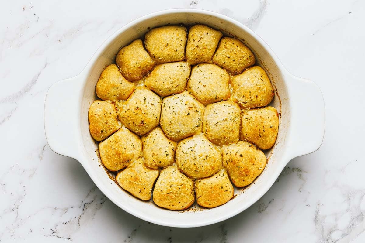 Freshly baked pepperoni pizza bites in a pan. 