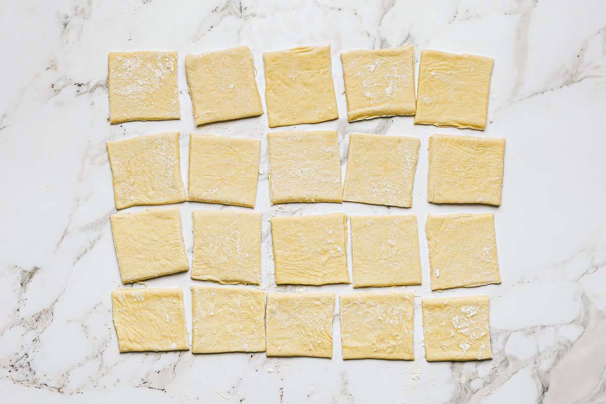 Squares of pizza dough to make pizza bites. 