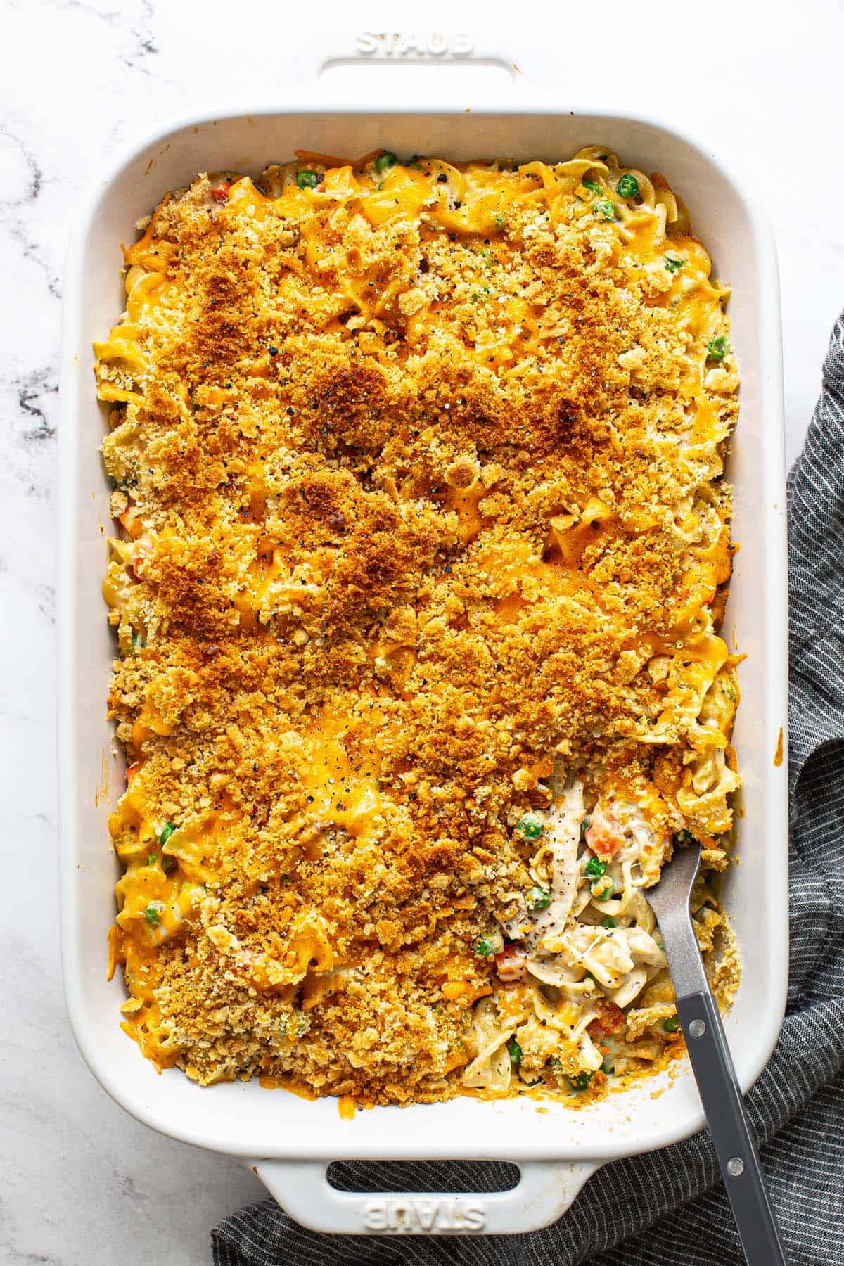 Freshly baked chicken noodle casserole in a large baking dish. 