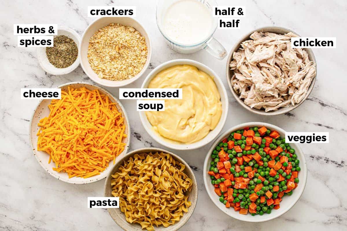 Bowls of ingredients for chicken noodle casserole. 