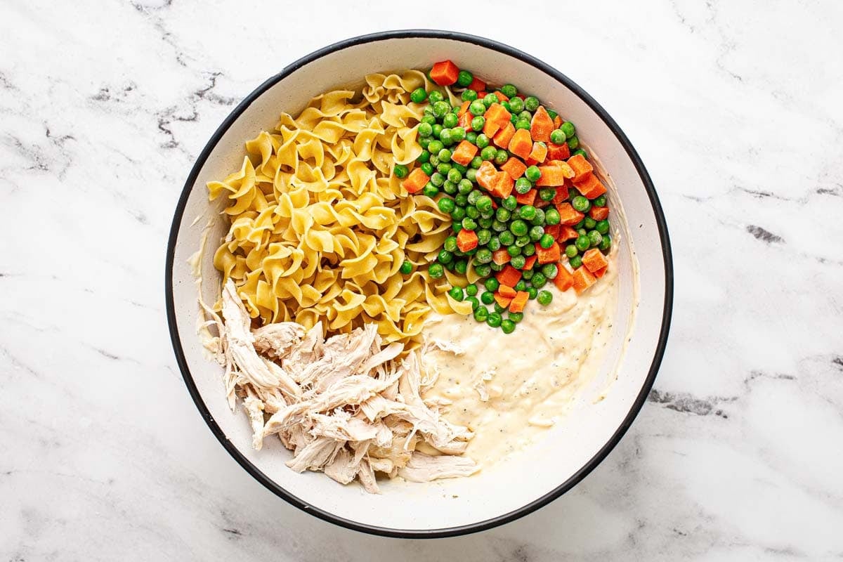 Noodles, frozen veggies, shredded chicken, and creamy sauce. 