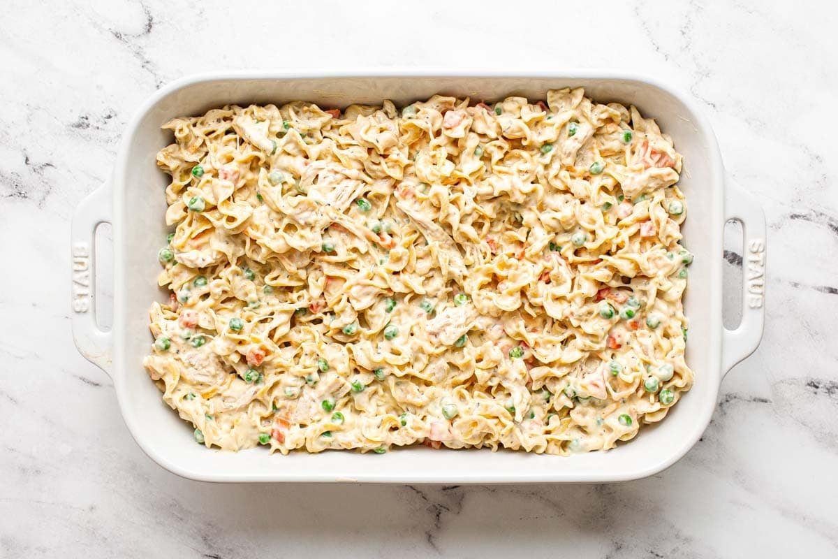 Creamy chicken noodle casserole in a large baking dish. 