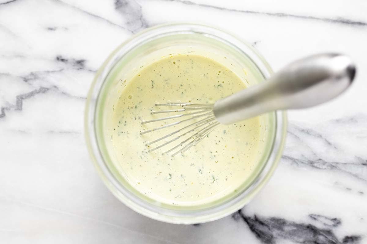 Homemade creamy pasta salad dressing in a mason jar. 