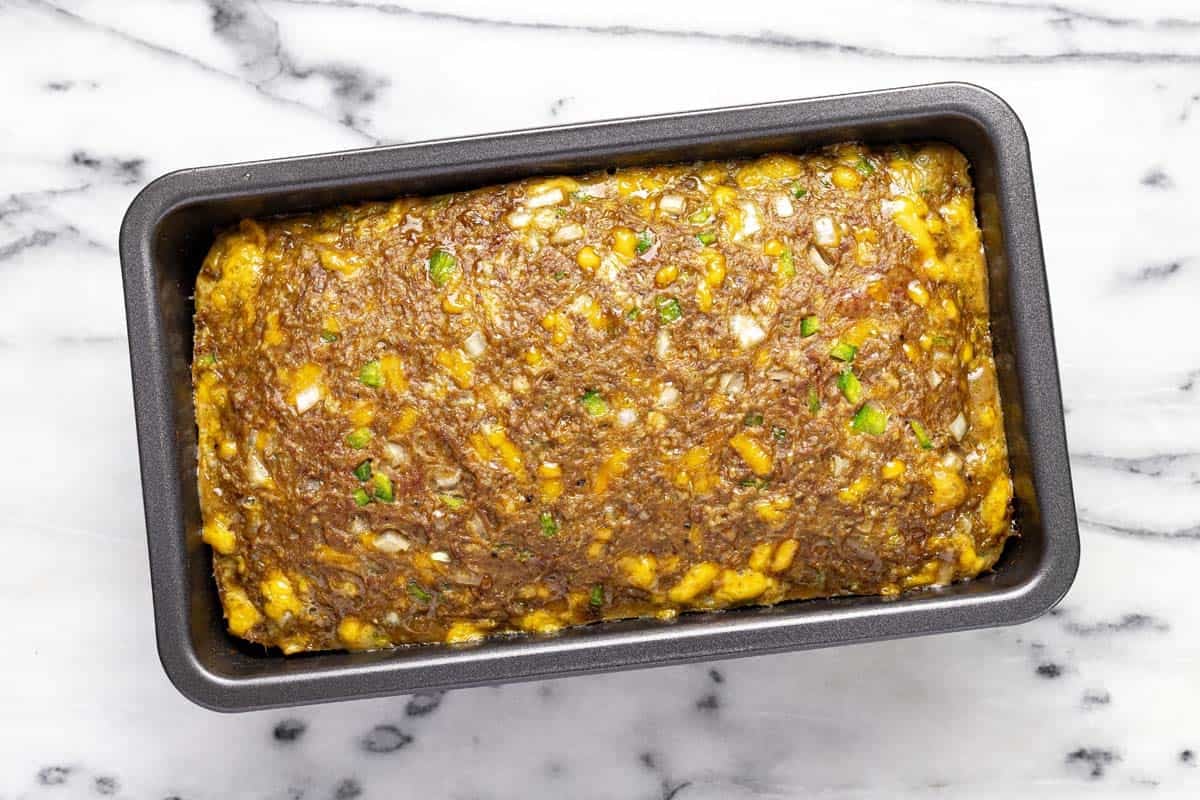 Loaf pan with freshly baked meatloaf in it. 