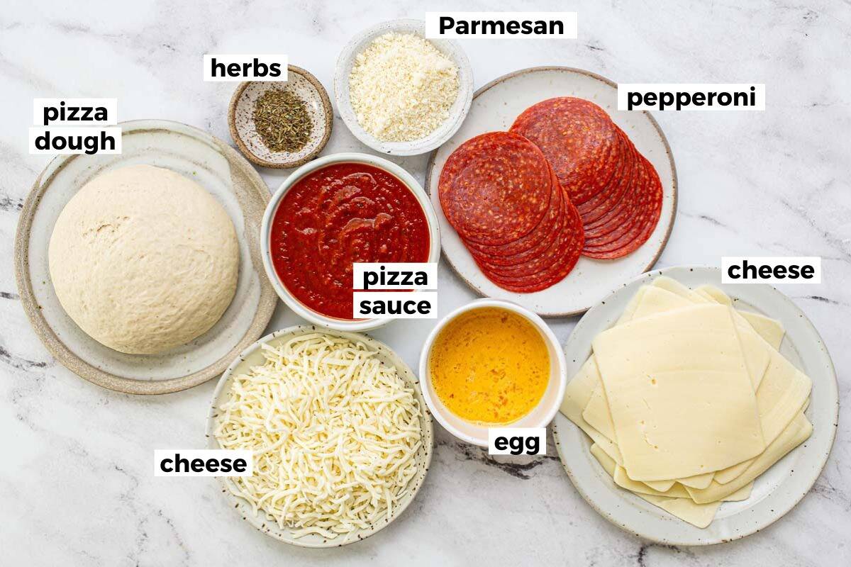 Bowls of ingredients to make an easy pepperoni stromboli. 