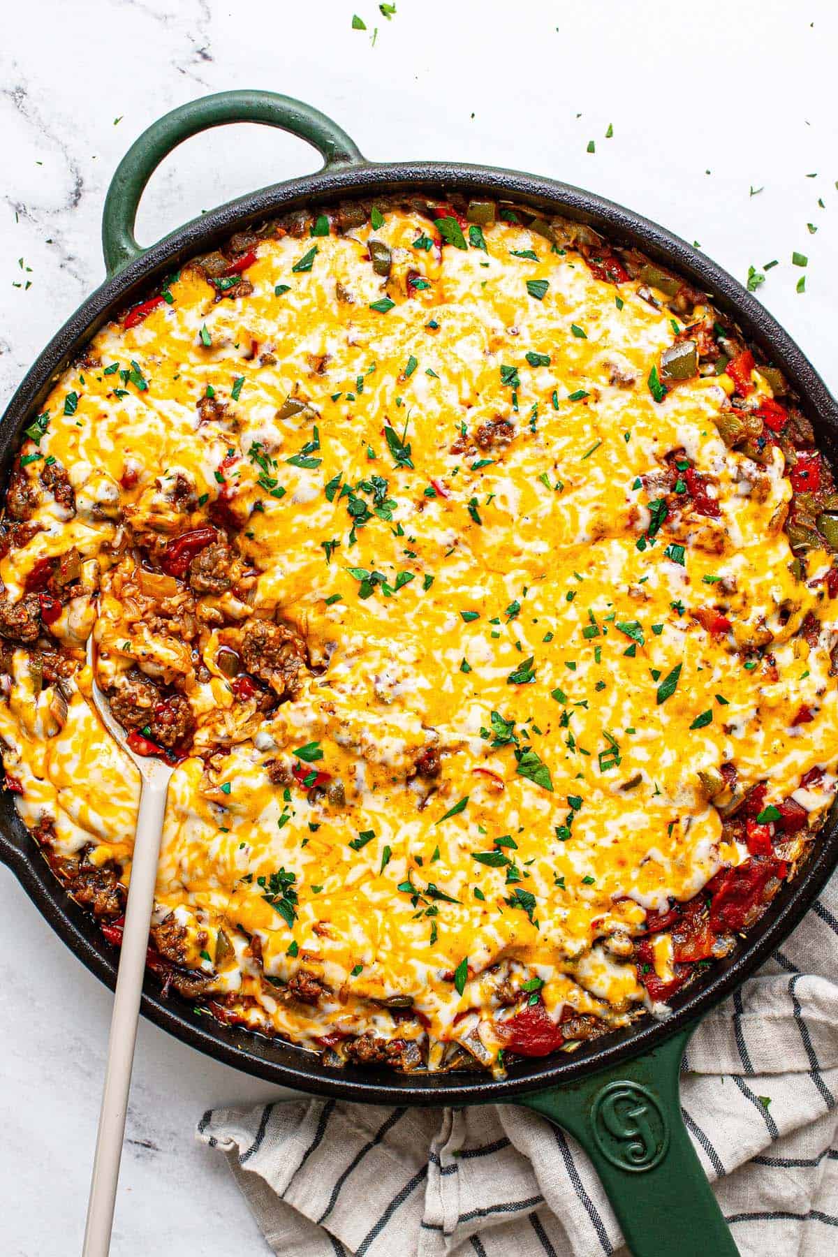 Homemade stuffed pepper casserole garnished with fresh parsley. 