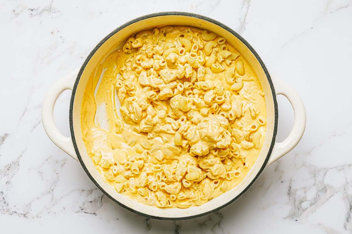Creamy mac and cheese in a large pan.