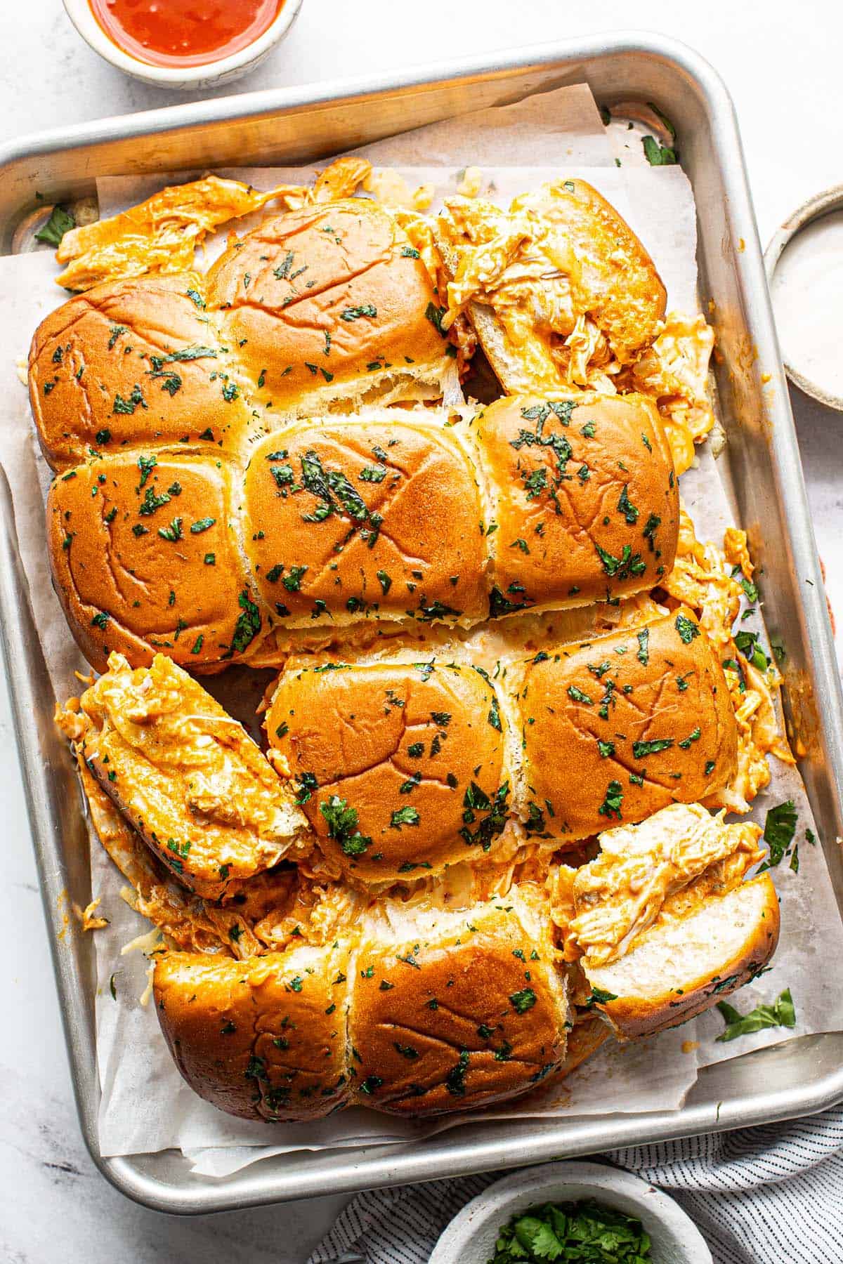 Pan filled with cheesy buffalo chicken sliders.