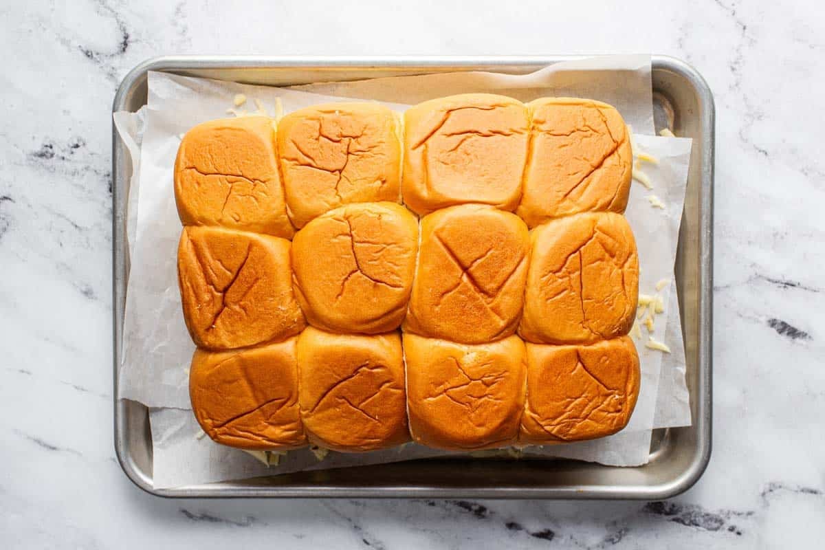 Pan with buffalo chicken sliders ready for the oven. 