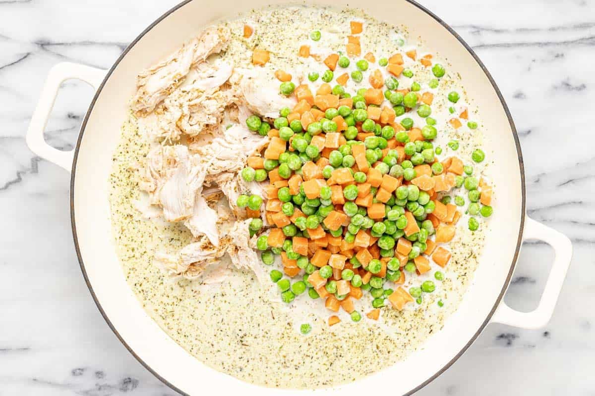 Shredded chicken and frozen veggies in a creamy sauce. 