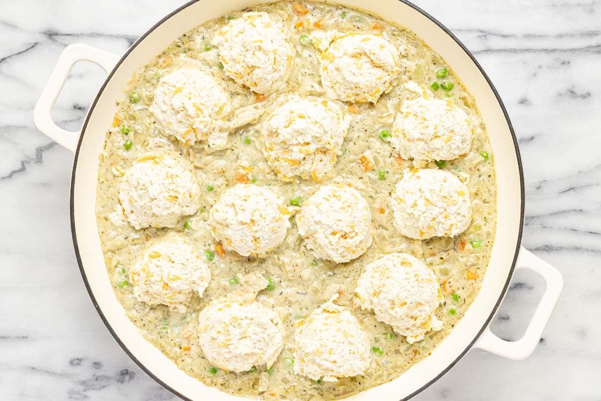 Biscuit dough on top of creamy chicken and veggies. 