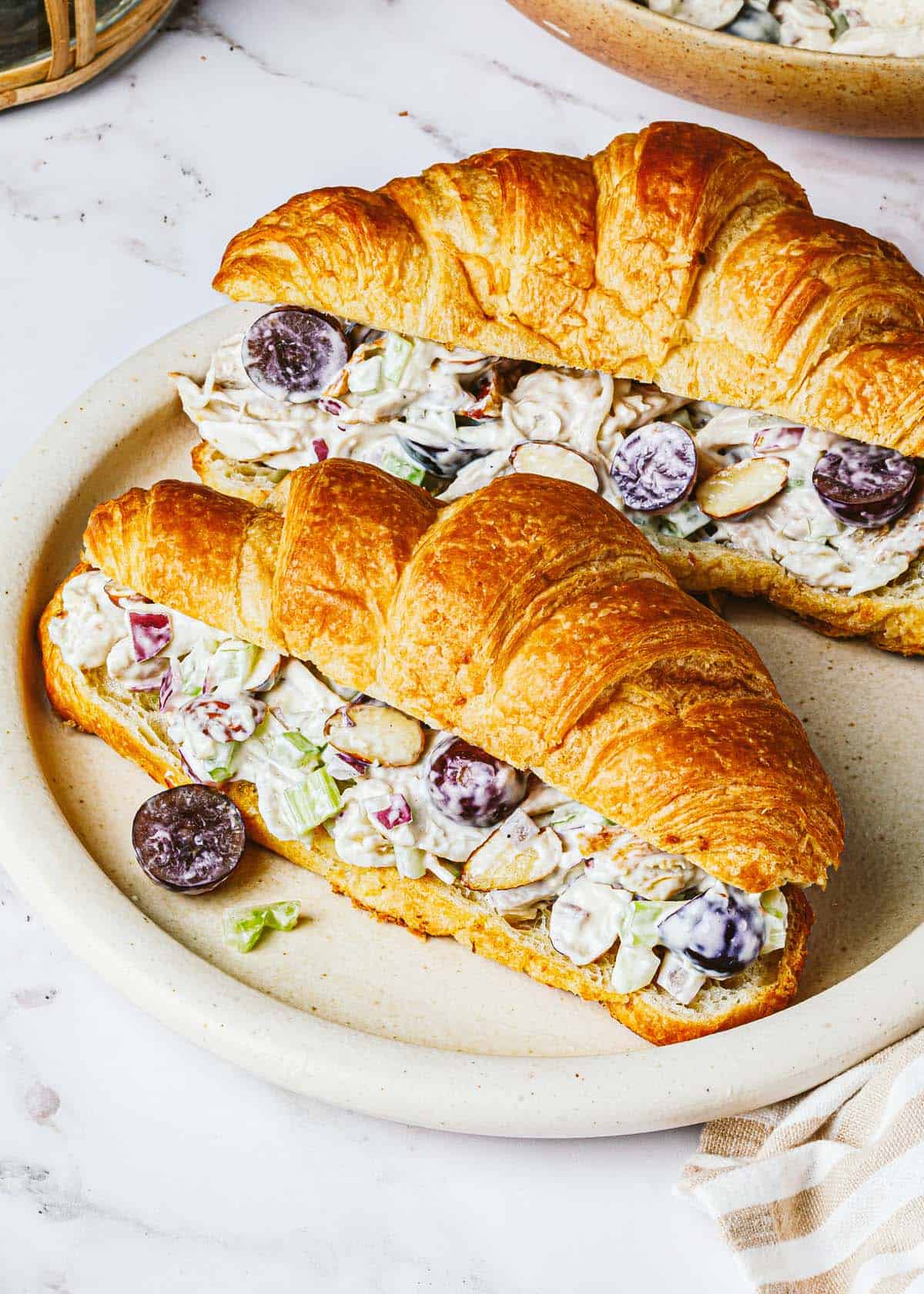 Chicken salad on 2 crossiants sliced lengthwise. 